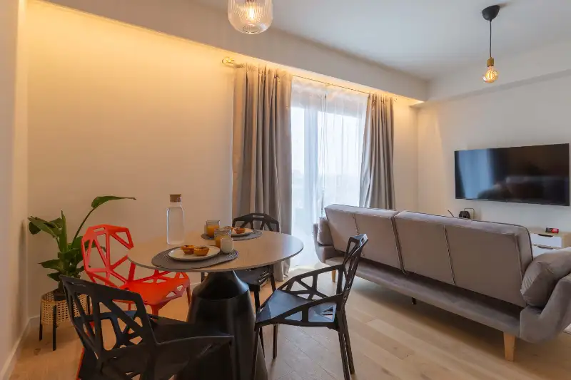 Dining area next to the living room and balcony