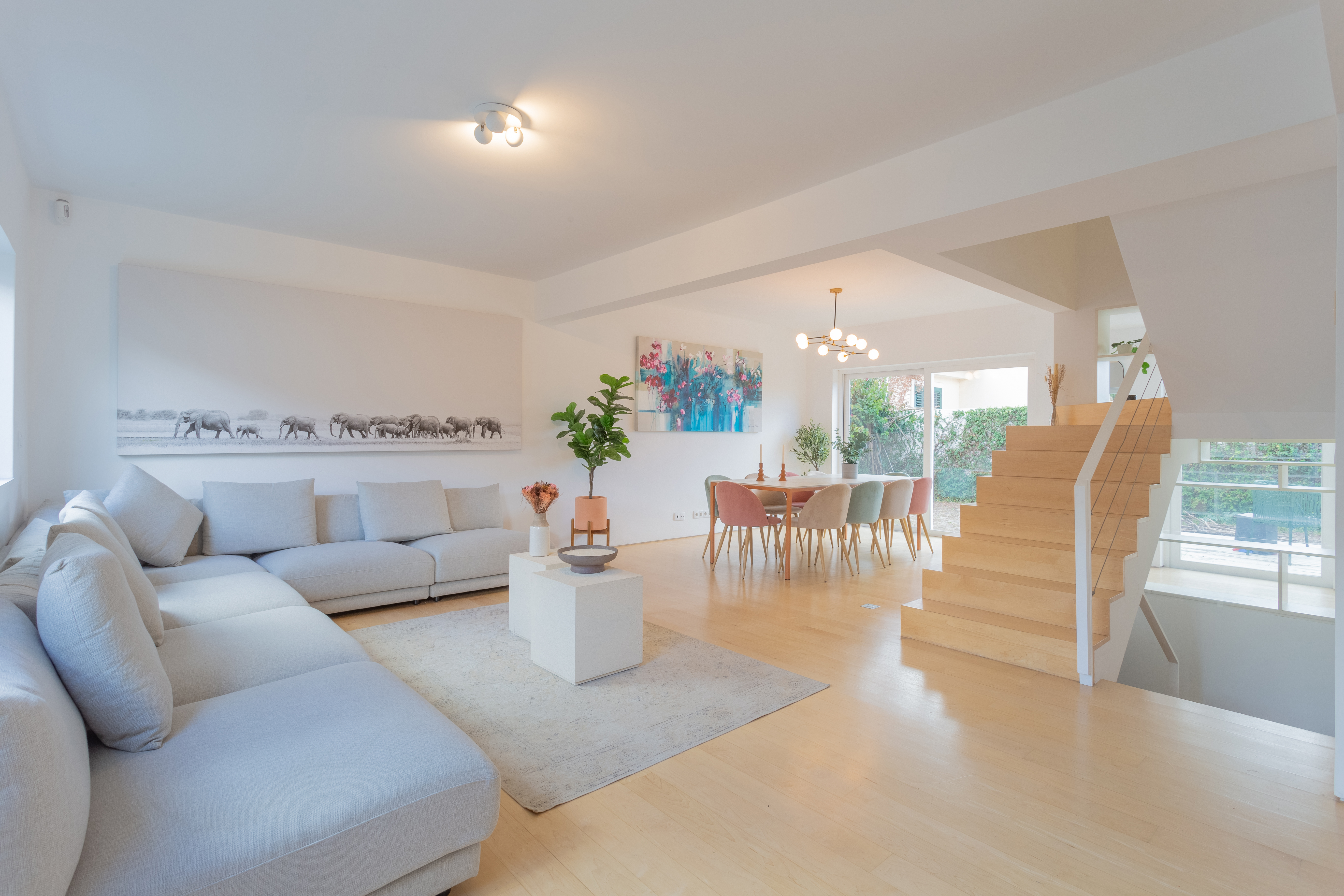Bright open plan living and dining room in a Lisbon home managed by LD Ninja Stays